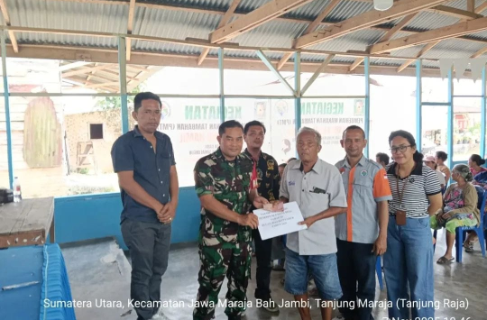 Acara penyaluran BLT‑DD Tahap III di Balai Harungguan Nagori Pokkan Baru (foto; Pendim0207/Sml)